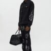 Stacked Skinny Flare Skulls Jeweled Distressed Jean