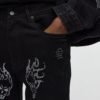 Stacked Skinny Flare Skulls Jeweled Distressed Jean